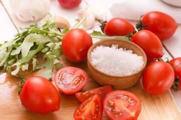 Chopped tomatoes with arugula