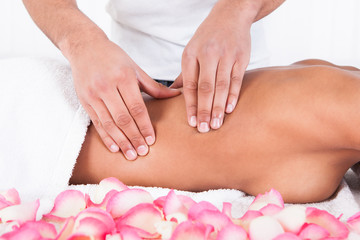 Obraz na płótnie Canvas Woman Receiving Massage At Spa