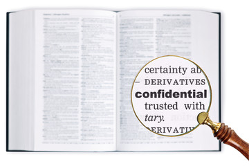 Confidential through a magnifying glass over Dictionary.