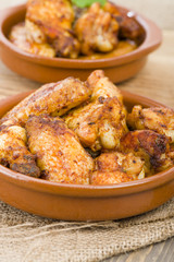 Pollo al Ajillo (Garlic Chicken Wings) with crusty bread & beer.