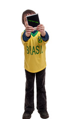 little boy holds a instant photo in front of his face