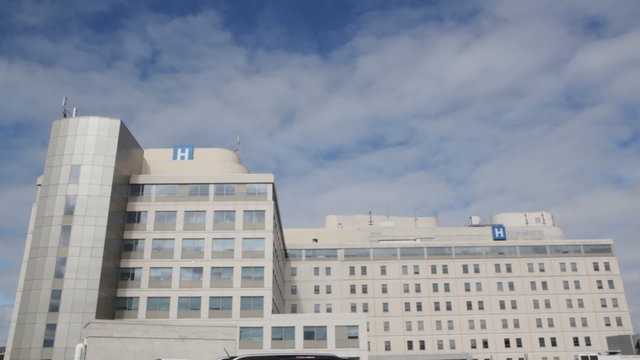 Hospital With Timelapse Clouds.