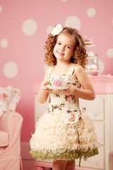 Little sweet girl with tea