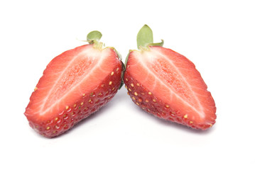 Сut in half strawberry isolated on white