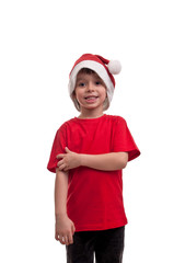 Portrait of little boy in Santa hat isolated on white