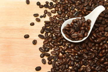 Close up of coffee Beans in white spoon