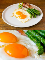 Asparagi with fired egg brown over wooden table and isolated on