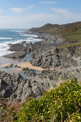 Rugged coast blue sea Woolacombe Devon England