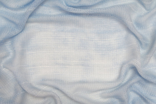 It is a drapery of light blue fabric.