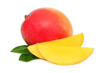 One whole mango and slices with green leaves (isolated)
