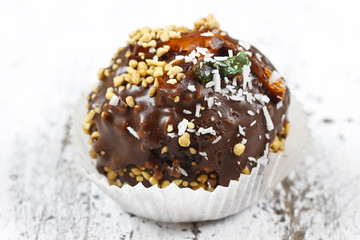 Big chocolate cupcake in round shape