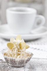 Pretty small cupcakes, lavishly decorated.