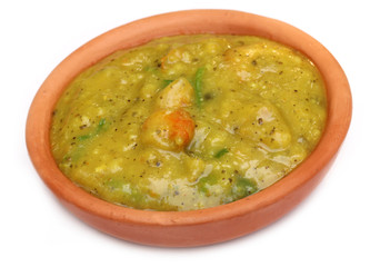Bengali cuisine – Mashkalai dal with shrimp on a clay pottery
