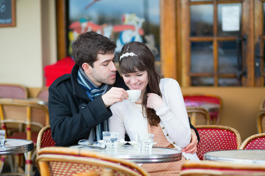 Couple drinking coffee in a cafe