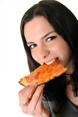Young happy woman eating pizza