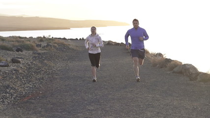Tired woman catching breath during jogging - Powered by Adobe