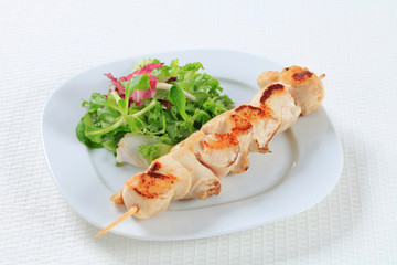 Chicken skewer with salad greens