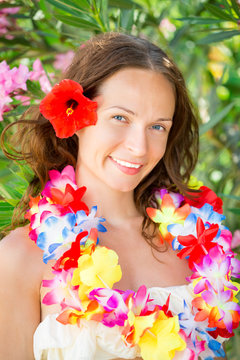 Woman in hawaiian flowers garland