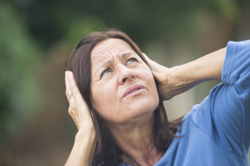 Stressed mature woman angry outdoor