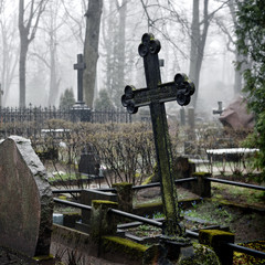 cross in fog at the cemetary