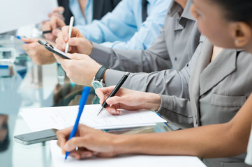 Business People Writing Note In Meeting