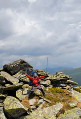 Obraz premium Happy hiker against stones.
