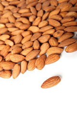 Seed of almonds nuts over white