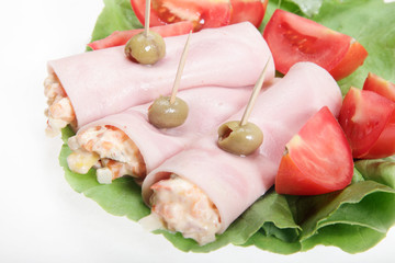 Sliced ham with vegetable salad