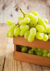 Fresh grapes in the wooden box