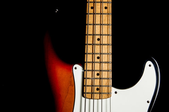 bass guitar on black background