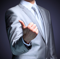 The businessman, a gesture, a finger.