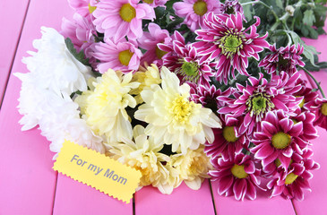 Bouquet of beautiful chrysanthemums on table close-up