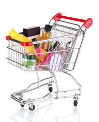 Cosmetics in cart isolated on white