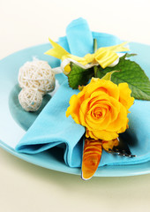 Served plate with napkin and flowers close-up