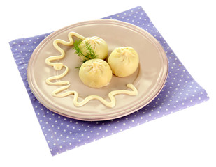 Tasty khinkali on plate, isolated on white