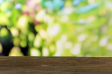 Naklejka na ściany i meble Wooden table on bright green background