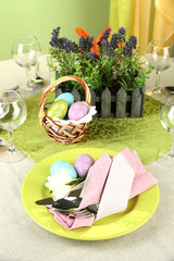 Easter table setting on color background