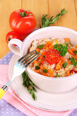 Delicious rice with vegetables and herbs in pot