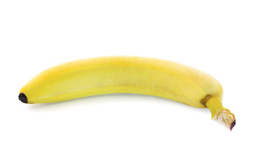 Single yellow spotless banana over white