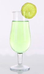 Green cocktail with lime isolated on white