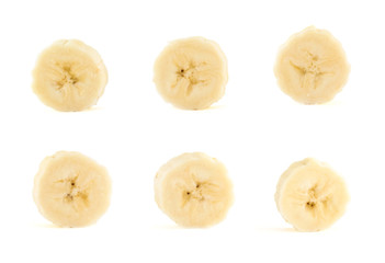 Six banana slices set over white background