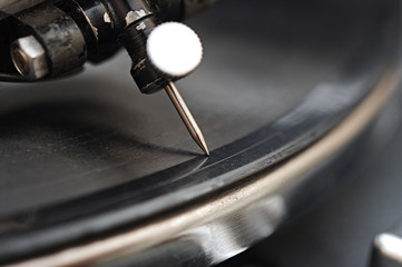 gramophone needle in vinyl records. A very extreme macro.