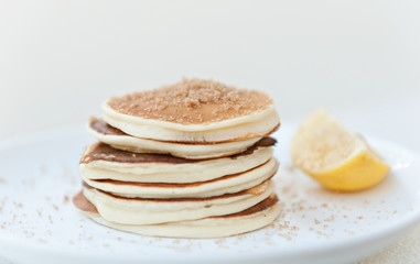 front view pancakes with brown sugar and lemon