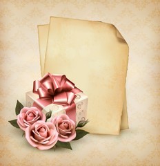 Retro holiday background with pink roses and gift box and old pa