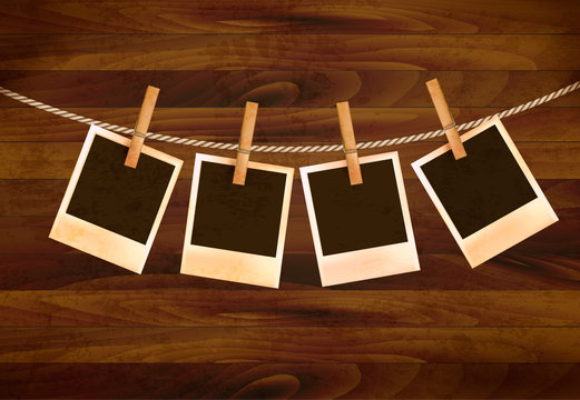 Retro photos hanging on a rope on dark wooden background. Vector