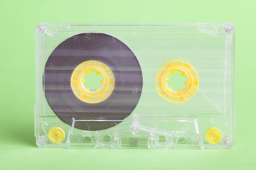 Audio cassette on green background