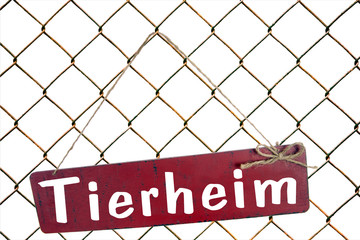 Schild an einem Zaun - Tierheim