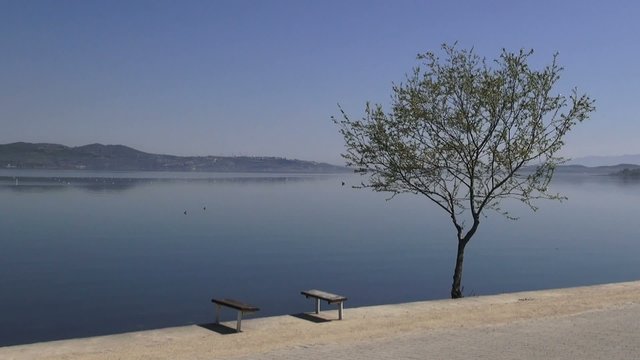View of the lake coast in calm, windless weather
