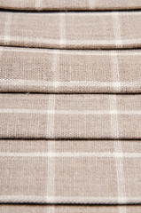 Fototapeta premium Background of linen. Figure in the cell.