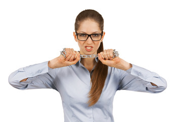 Young woman trying to break a steel chain